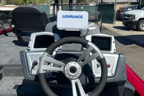 Slide: The Image of 2025 Tracker Pro Team 175 boat dashboard with Lowrance navigation system. - 5