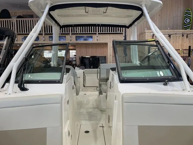 Slide: The Image of 2025 Boston Whaler 240 Vantage boat interior with dual consoles and open deck. - 16
