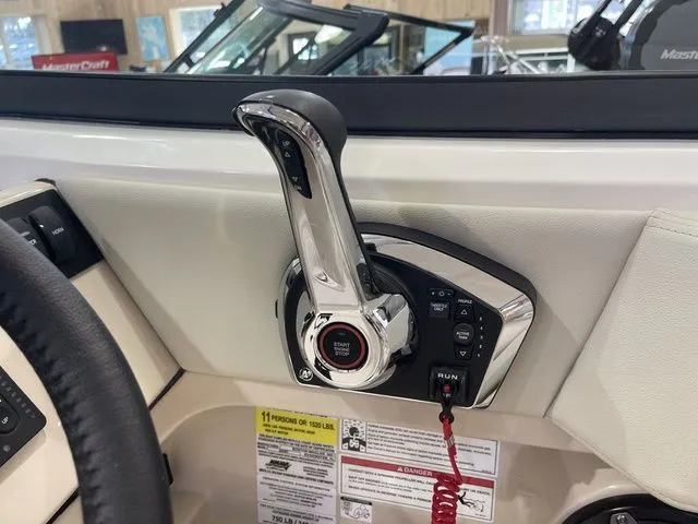 Slide: The Image of 2025 Boston Whaler 240 Vantage throttle control in a boat cockpit. - 19