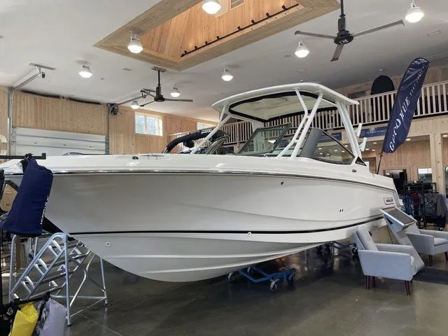 Slide: The Image of 2025 Boston Whaler 240 Vantage boat displayed indoors, showcasing sleek design and modern features. - 4