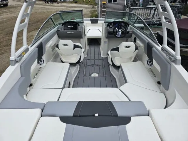 Slide: The Image of 2023 Chaparral 23 SSi OB boat interior with modern seating and steering wheel. - 3
