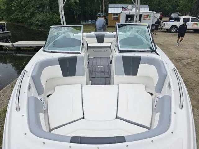 Slide: The Image of 2023 Chaparral 23 SSi OB boat with spacious seating and open deck design. - 4