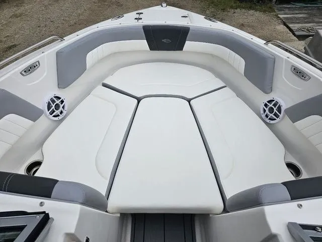 Slide: The Image of 2023 Chaparral 23 SSi OB boat interior with white and gray seating. - 9
