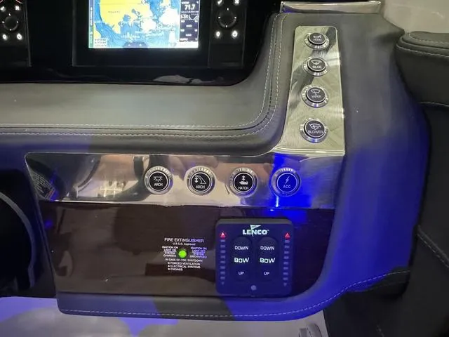 Slide: The Image of 2024 Chaparral 307 SSX dashboard with control panel and navigation display. - 14