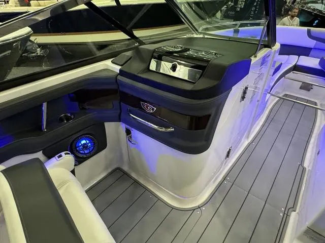 Slide: The Image of 2024 Chaparral 307 SSX boat interior with modern dashboard and seating. - 16