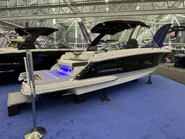 Slide: The Image of 2024 Chaparral 307 SSX boat displayed indoors on blue carpet. - 3
