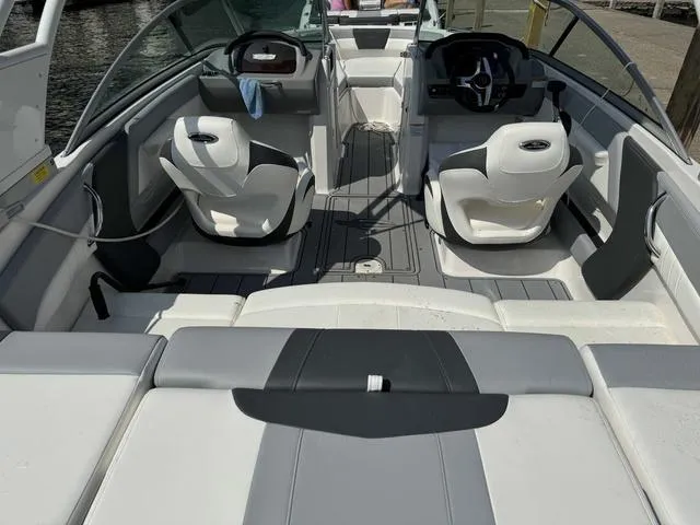 Slide: The Image of 2024 Chaparral 21 SSi boat interior with modern seating and steering wheel. - 8