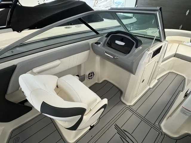 Slide: The Image of 2024 Chaparral 21 SSi boat interior with modern seating and dashboard design. - 17