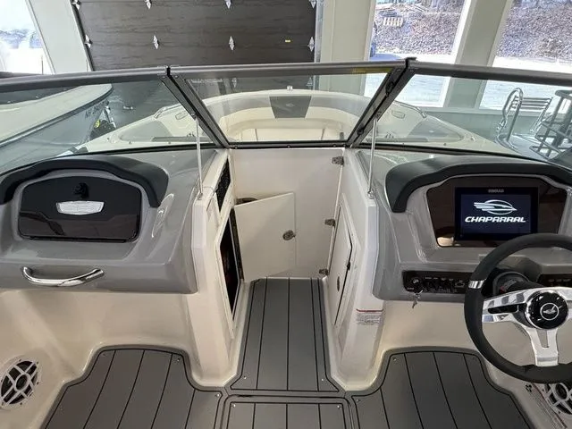 Slide: The Image of 2024 Chaparral 21 SSi boat interior with modern dashboard and steering wheel. - 19