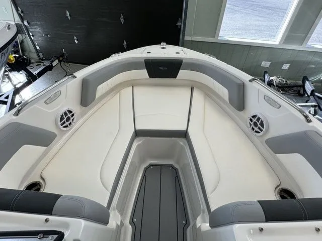 Slide: The Image of 2024 Chaparral 21 SSi boat interior with gray and white seating and speakers. - 20