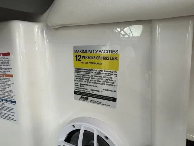Slide: The Image of 2024 Chaparral 21 SSi boat capacity label, maximum 12 persons or 1692 lbs. - 22