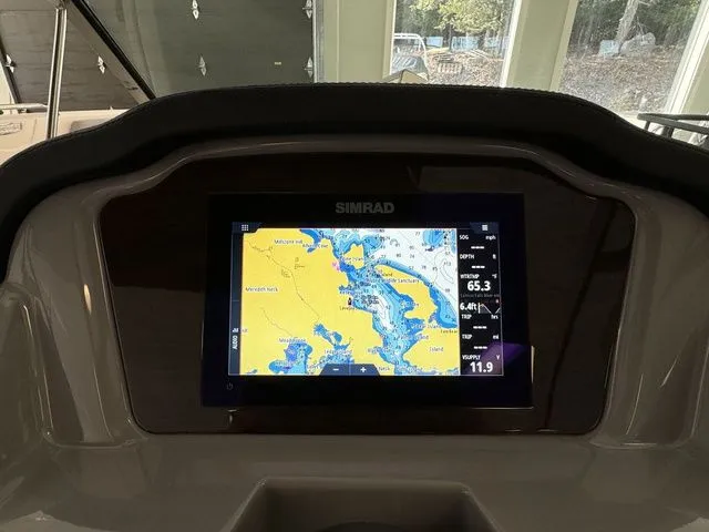 Slide: The Image of Simrad navigation display on 2024 Chaparral 21 SSi boat dashboard. - 23