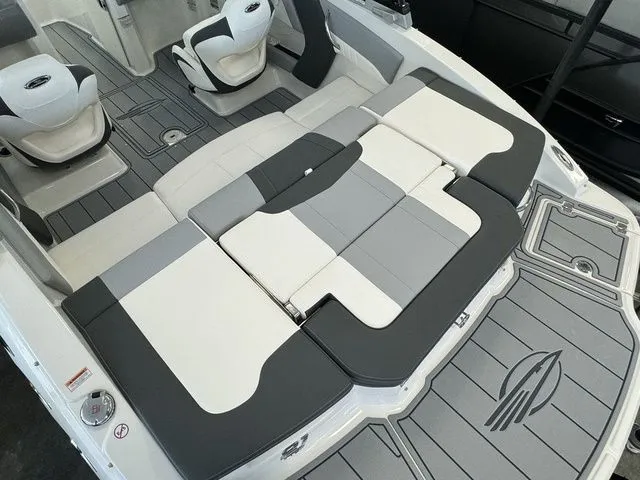 Slide: The Image of 2024 Chaparral 21 SSi boat interior with gray and white seating and flooring. - 9