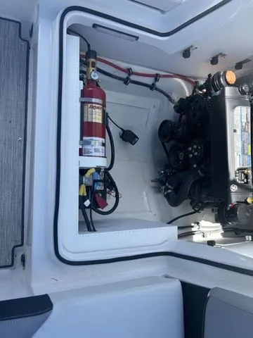 Slide: The Image of 2024 Cobalt CS22 engine compartment with fire extinguisher and mechanical components. - 4