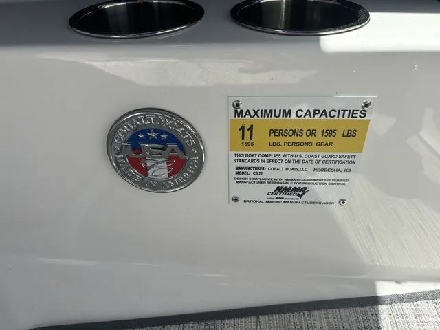 Slide: The Image of 2024 Cobalt CS22 boat capacity label, seating for 11, maximum weight 1595 lbs. - 6