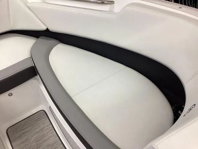 Slide: The Image of 2024 Cobalt 220S boat interior with sleek white and gray seating design. - 11