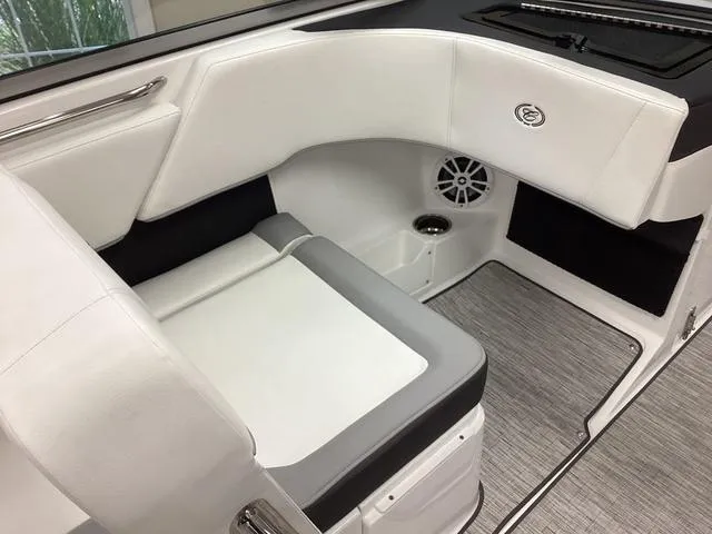 Slide: The Image of 2024 Cobalt 220S boat interior with white seating and modern design. - 12