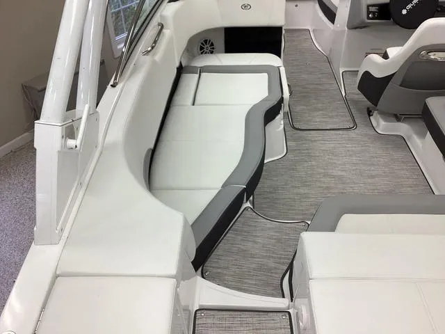 Slide: The Image of 2024 Cobalt 220S boat interior with white and gray seating and flooring. - 19