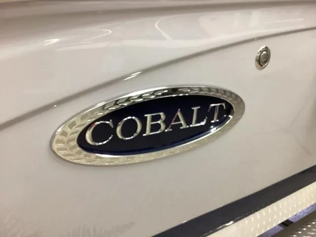 Slide: The Image of 2024 Cobalt 220S boat emblem on sleek white surface. - 4