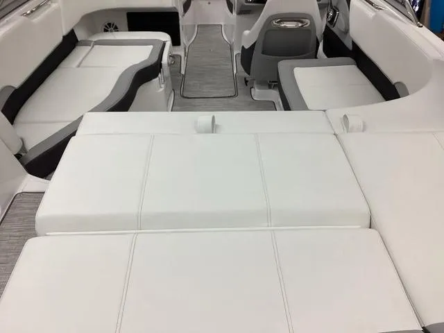 Slide: The Image of 2024 Cobalt 220S boat interior with white and gray seating, modern design. - 5