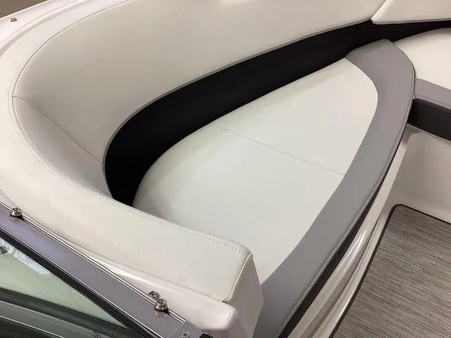 Slide: The Image of 2024 Cobalt 220S boat interior with white and gray seating. - 8