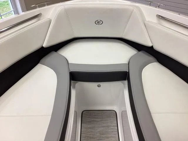 Slide: The Image of 2024 Cobalt 220S boat interior with white and gray seating. - 9