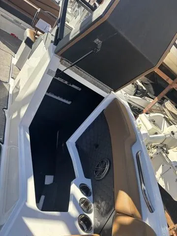 Slide: The Image of 2025 Cobalt R4 Surf boat interior with brown seating and modern design. - 15