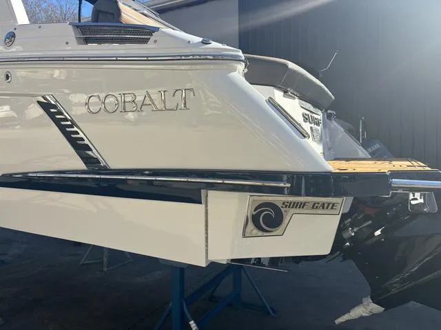 Slide: The Image of 2025 Cobalt R4 Surf boat with Surf Gate technology, rear view. - 3