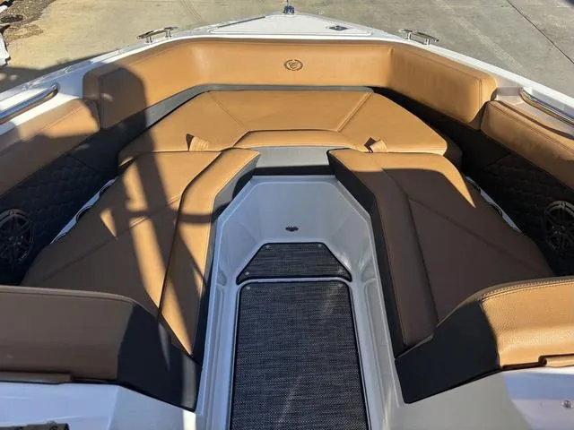 Slide: The Image of 2025 Cobalt R4 Surf boat interior with tan seating and modern design. - 7