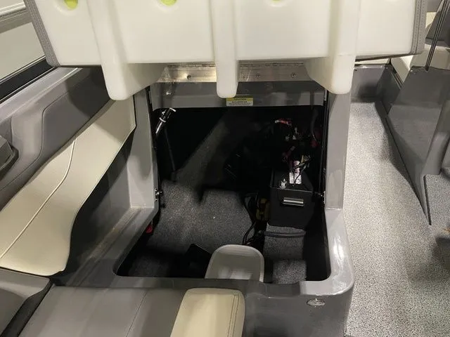 Slide: The Image of 2024 MasterCraft XT20 interior showing storage compartment and seating area. - 16