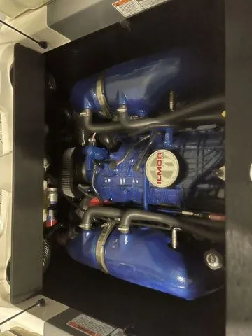 Slide: The Image of 2024 MasterCraft XT20 engine, featuring a powerful Ilmor motor in a sleek, compact design. - 19