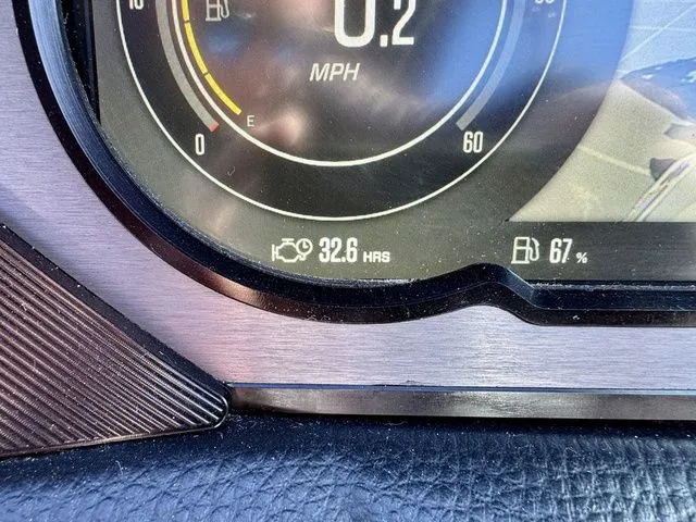 Slide: The Image of Close-up of 2022 MasterCraft XStar dashboard showing 0.2 MPH, 32.6 engine hours, 67% fuel. - 24