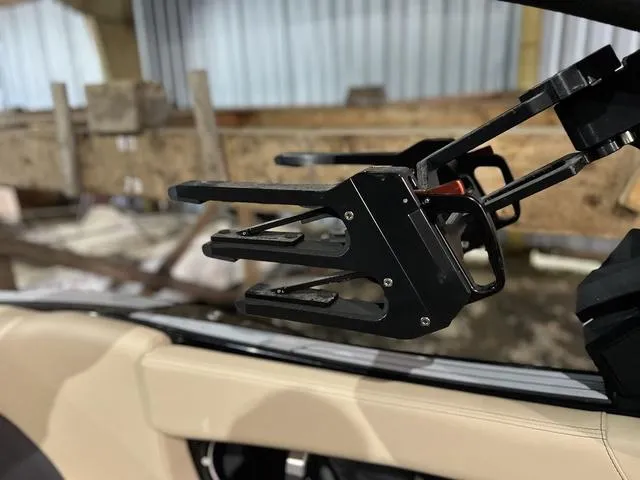 Slide: The Image of 2024 MasterCraft X24 boat interior with a close-up of a wakeboard rack. - 12