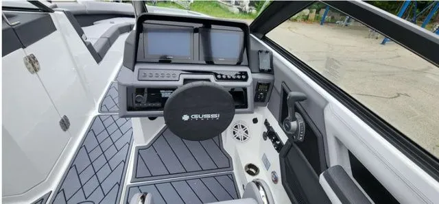 Slide: The Image of 2024 Cobalt R8 boat cockpit with modern steering and navigation controls. - 10