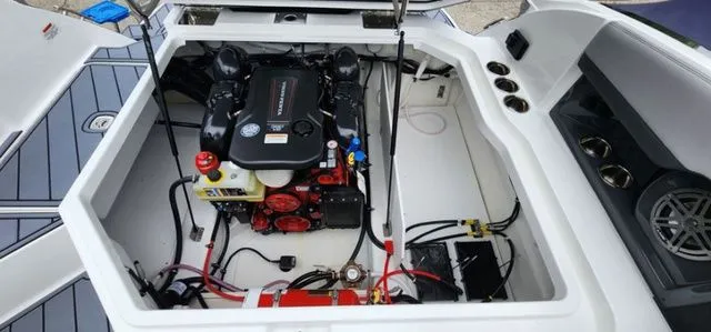 Slide: The Image of 2024 Cobalt R8 engine compartment showcasing modern marine engine and components. - 13