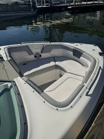 Slide: The Image of 2019 Chaparral 23 H2O Sport boat with spacious bow seating at a marina. - 3