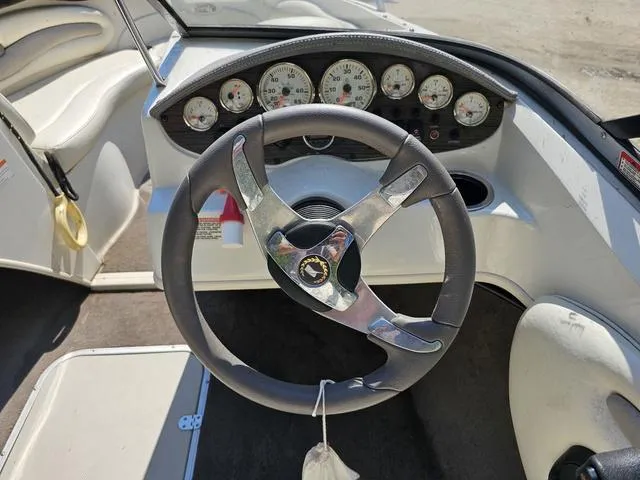 Slide: The Image of Steering wheel and dashboard of a 2011 Stingray 195 LX boat. - 5