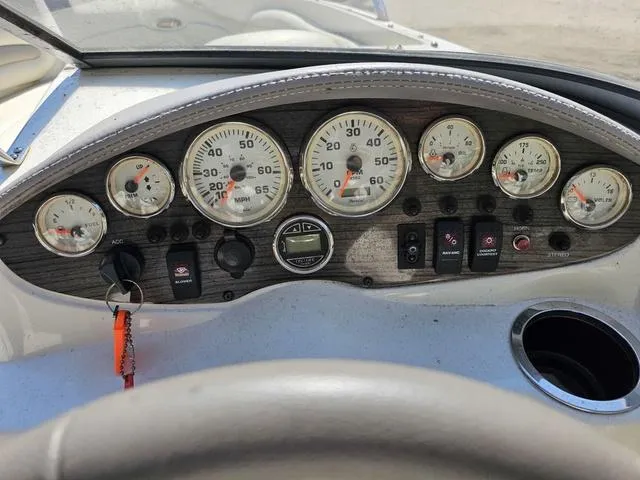 Slide: The Image of Dashboard of a 2011 Stingray 195 LX boat with gauges and controls. - 6