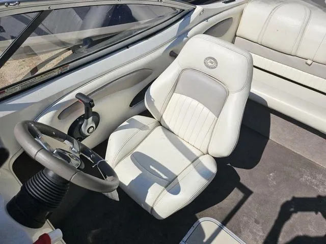 Slide: The Image of 2011 Stingray 195 LX boat interior with steering wheel and seating. - 7