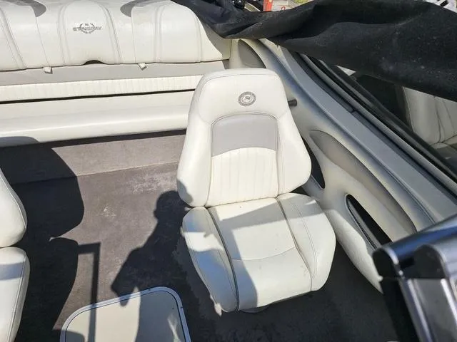 Slide: The Image of 2011 Stingray 195 LX boat interior with white seating and upholstery. - 8