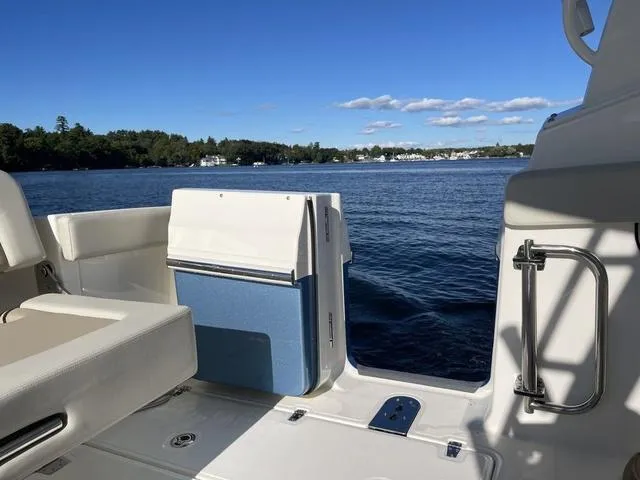 Slide: The Image of 2024 Boston Whaler 280 Vantage boat interior with scenic lake view. - 20