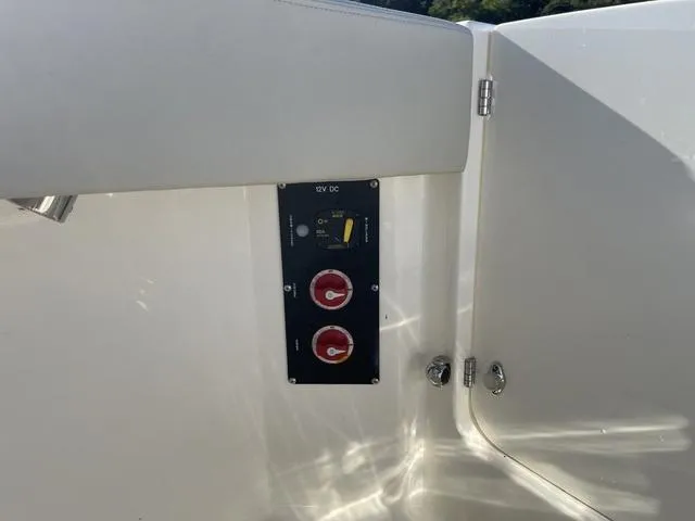 Slide: The Image of 2024 Boston Whaler 280 Vantage boat control panel with switches and dials. - 22