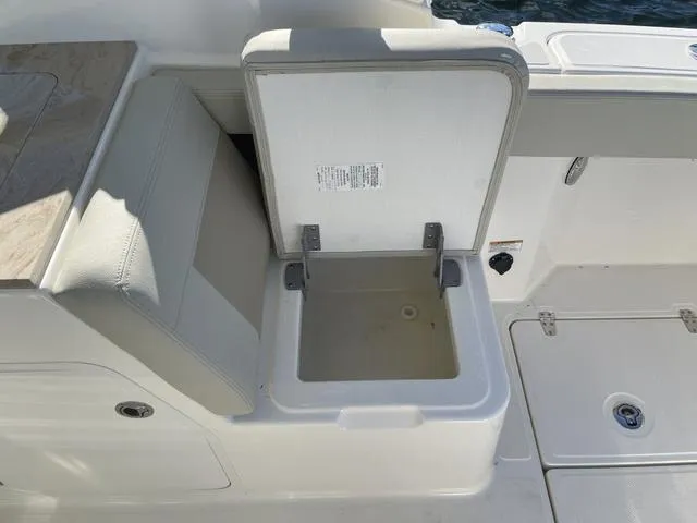 Slide: The Image of Open storage compartment on a 2024 Boston Whaler 280 Vantage boat. - 25