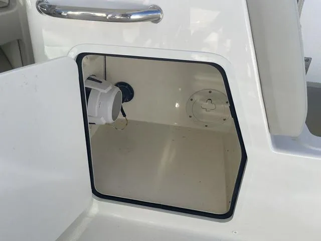 Slide: The Image of Open storage compartment on a 2024 Boston Whaler 280 Vantage boat. - 27