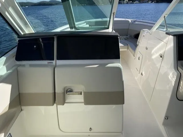 Slide: The Image of 2024 Boston Whaler 280 Vantage boat interior with seating, on a sunny day. - 35