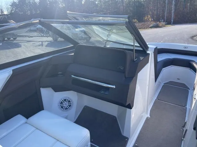 Slide: The Image of 2022 Cobalt R4 boat interior with white seating and modern dashboard design. - 14
