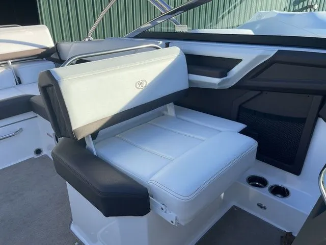 Slide: The Image of 2022 Cobalt R4 boat interior with white and black seating, modern design. - 15