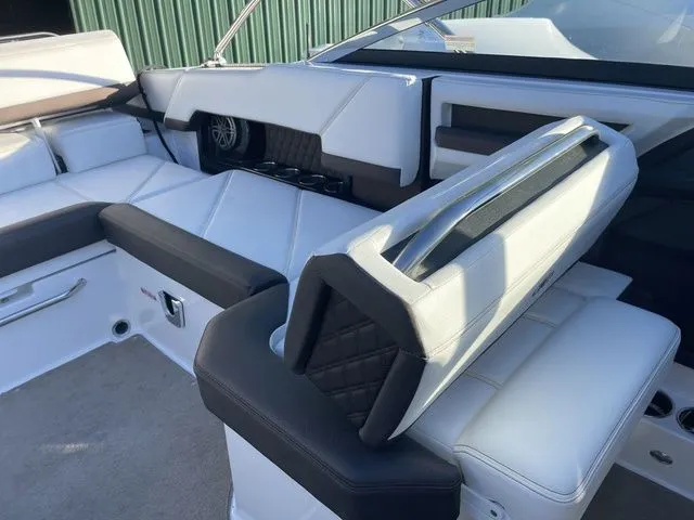 Slide: The Image of 2022 Cobalt R4 boat interior with white and black seating, modern design. - 16