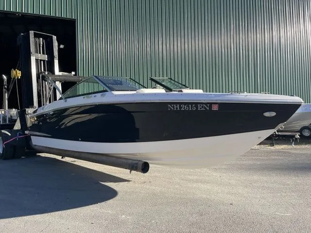 Slide: The Image of 2022 Cobalt R4 boat in front of a large warehouse, displayed on a forklift. - 3