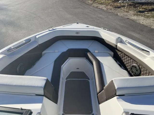 Slide: The Image of 2022 Cobalt R4 boat interior with cushioned seating and speaker system. - 7